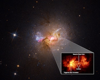 A pullout of the central region of dwarf starburst galaxy Henize 2-10 traces an outflow, or bridge o...