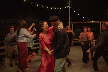 Olivia Colman as ‘Leda’ dances with Ed Harris as ‘Lyle’