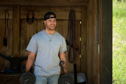 Austin Gunn from 'Relatively Famous: Ranch Rules' working in a barn.