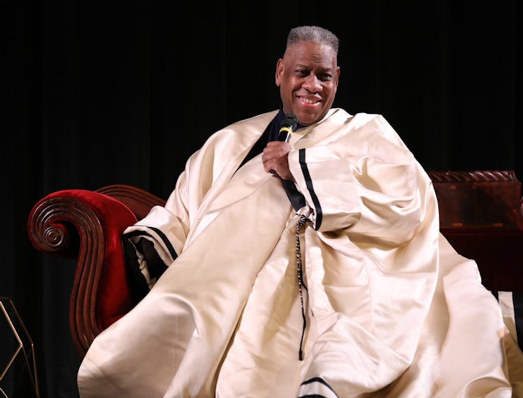 Andre Leon Talley on stage in an extravagant white cape.