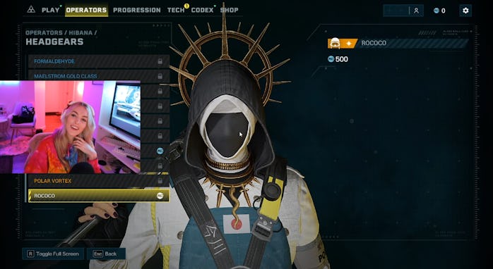 Screenshot from Kate Irwin's Twitch stream showing Hibana's Rococo headgear, which has black fabric ...