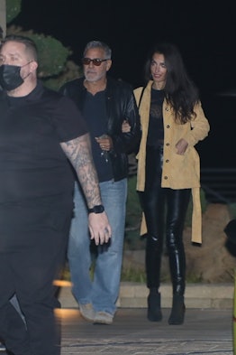 Amal Clooney wearing black leather pants.