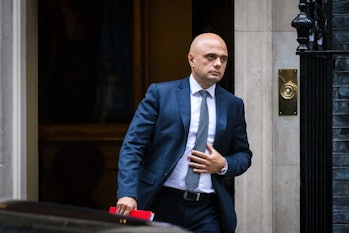 Sajid Javid exiting a building