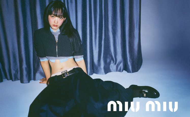 Miu Miu fashion campaign woman wearing long black skirt