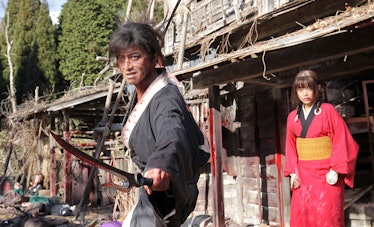 Takuya Kimura as Manji and Hana Sugisaki as Rin Asano in Blade of the Immortal