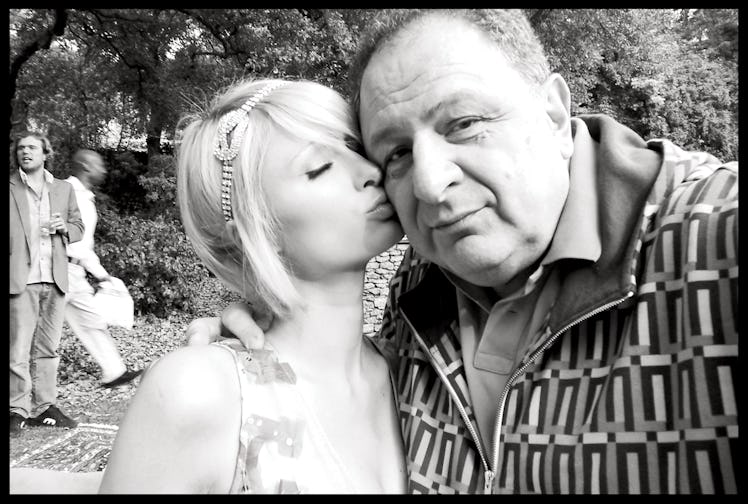A selfie of Paris Hilton kissing Jean Pigozzi on the cheek in black and white
