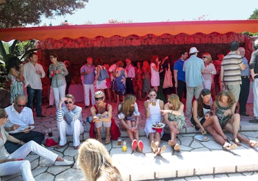 A crowd at a pool party in the South of France