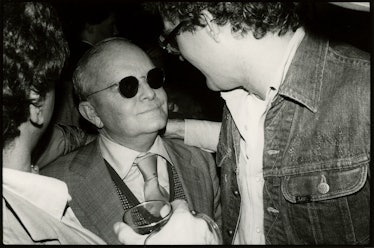 Truman Capote wearing sunglasses at Studio 54
