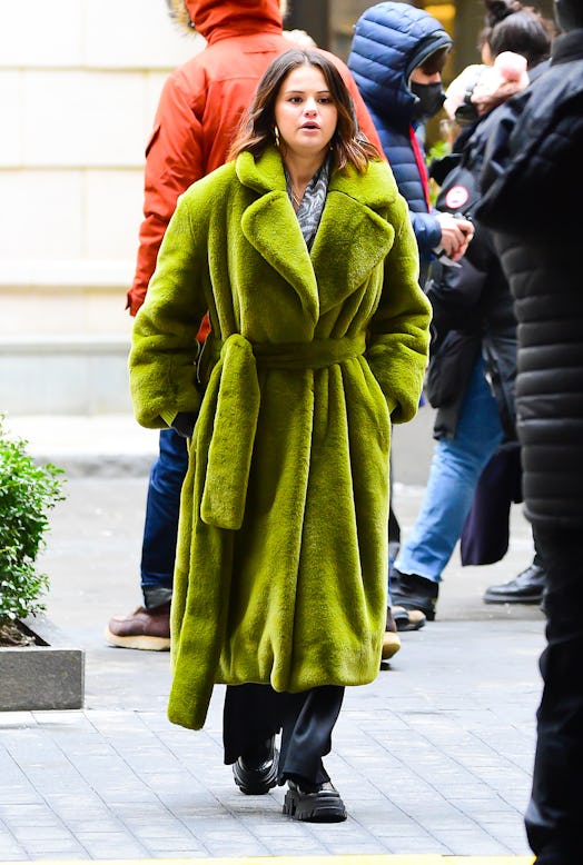Selena Gomez wearing a green coat on the set of Only Murders in the Building season 2