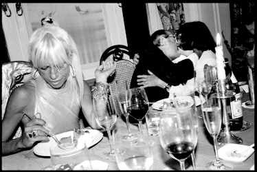 Helmut and June Newton’s 50th wedding anniversary party (above, the couple embrace next to Donatella...