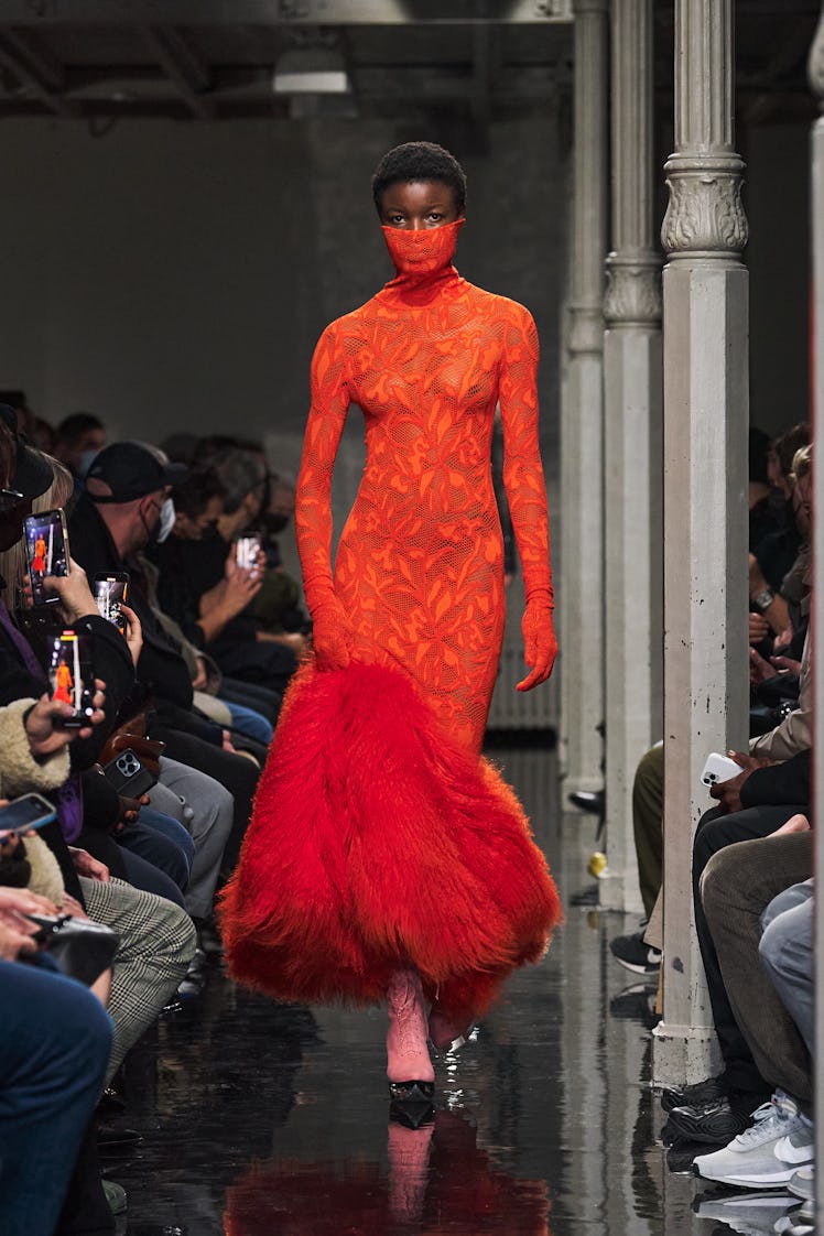 Model in red dress at Alaïa fall 2022 show.
