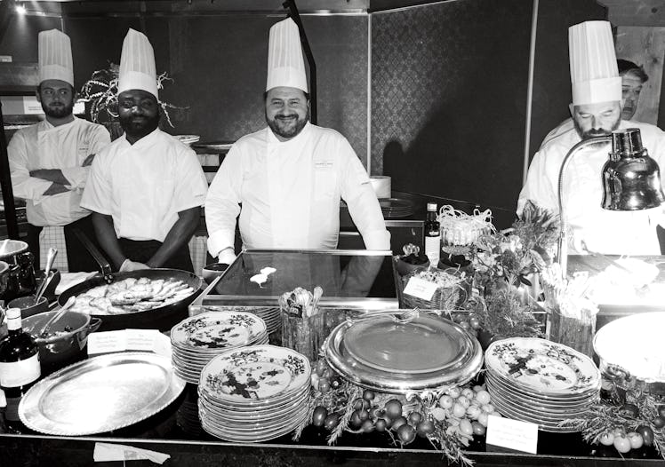 A group of caterers in front of a buffet