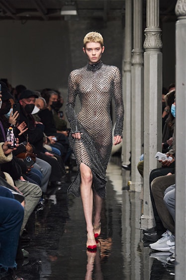 Model in sheer dress at Alaïa fall 2022 runway show
