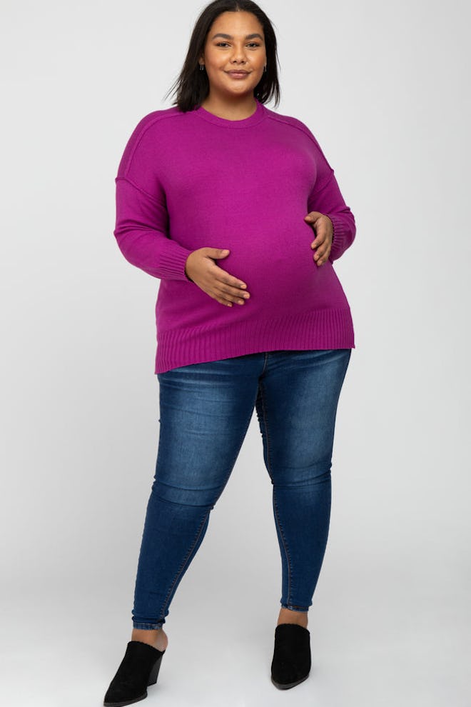 Pregnant woman modeling purple top