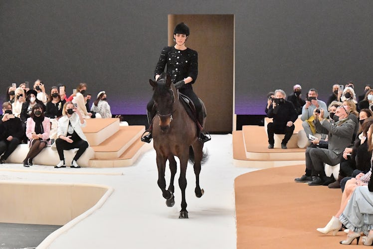 Charlotte Casiraghi riding a horse at the Chanel spring 2022 couture show
