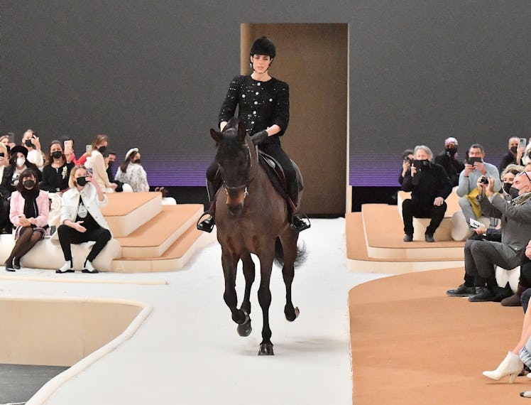 Charlotte Casiraghi riding a horse at the Chanel spring 2022 couture show