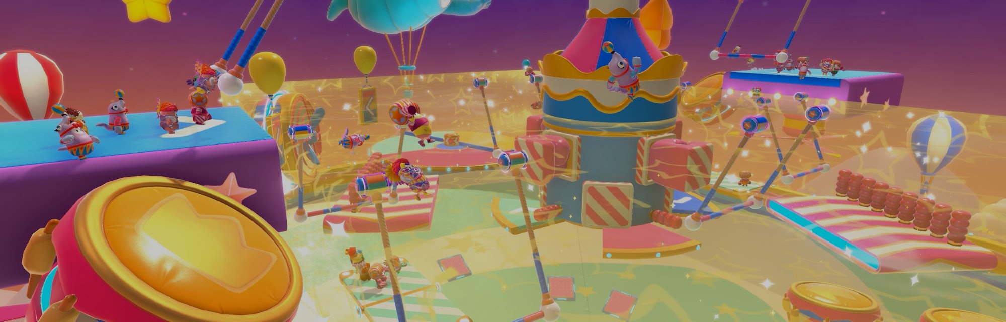 Image of Fall Guys game, showing a colorful obstacle course that resembles a circus carousel.