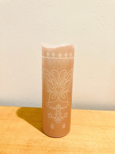 This replica candle is part of the 'Encanto' merchandise on Etsy. 