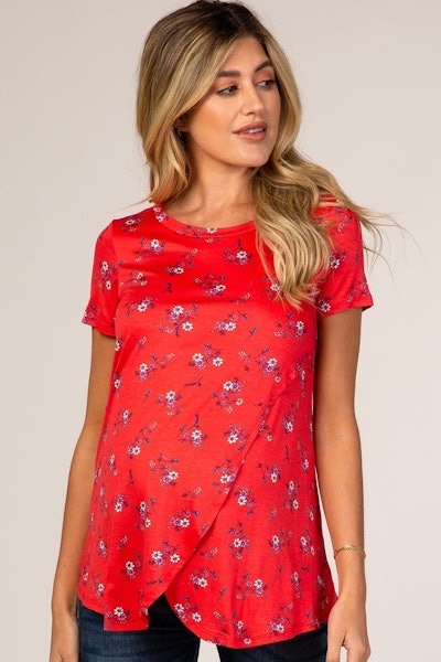 Pregnant woman modeling red top with floral print