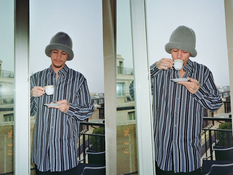 Dominic Fike sipping tea in Paris. 