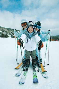 Happy siblings skiing 