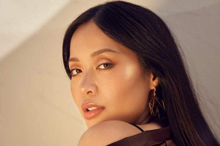 Michelle Phan looking over her shoulder at the camera