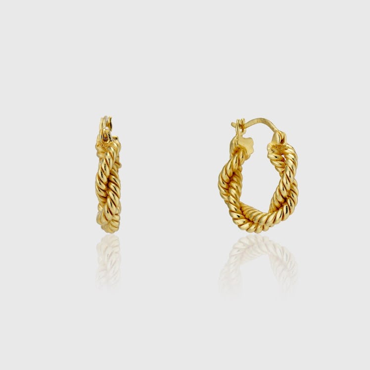 AUREUM gold twisted hoop earrings.