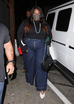 Lizzo wearing Tanya Taylor high-waisted jeans. 