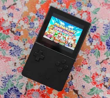 A photo of the Analogue Pocket playing 'Mario Kart'