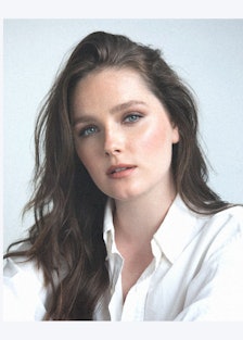 the actress amy forsyth wearing a white button down shirt
