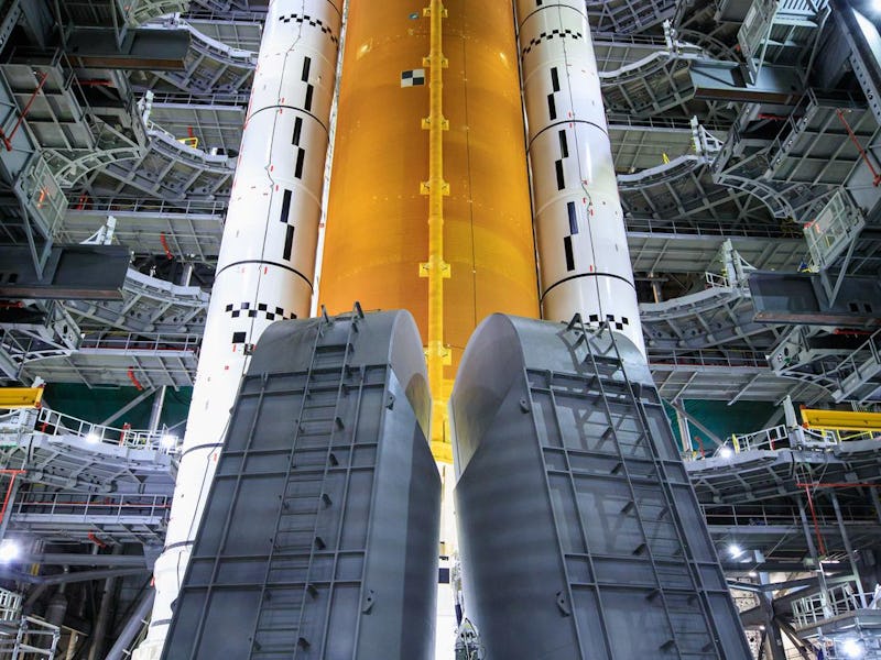 The inside of NASA's station with a big moon rocket that is almost ready