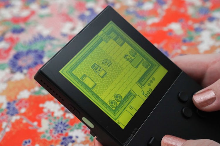 A photo of the Analogue Pocket with a green screen