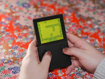 A photo of the Analogue Pocket with a green screen