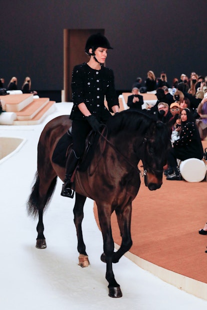 Charlotte Casiraghi riding at horse on the Chanel spring 2022 couture runway