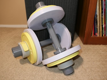 The Tempo Move "smart weights" with colorful removable plates. 