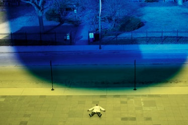 Virgil Abloh lying down on the sidewalk in Chicago