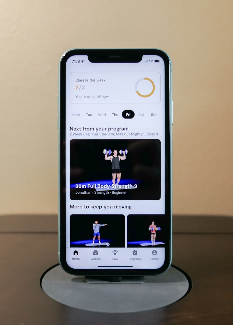 An iPhone 11 mounted in the Tempo Move's "Core" connecting the phone to a TV.