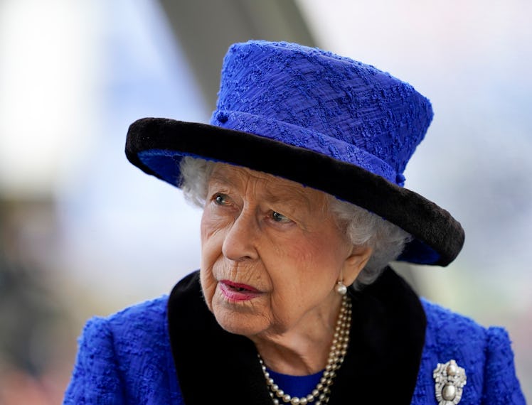 Queen Elizabeth II wearing a blue hat
