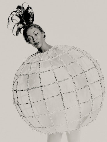 Naomi Campbell wears disco ball dress by Halpern.