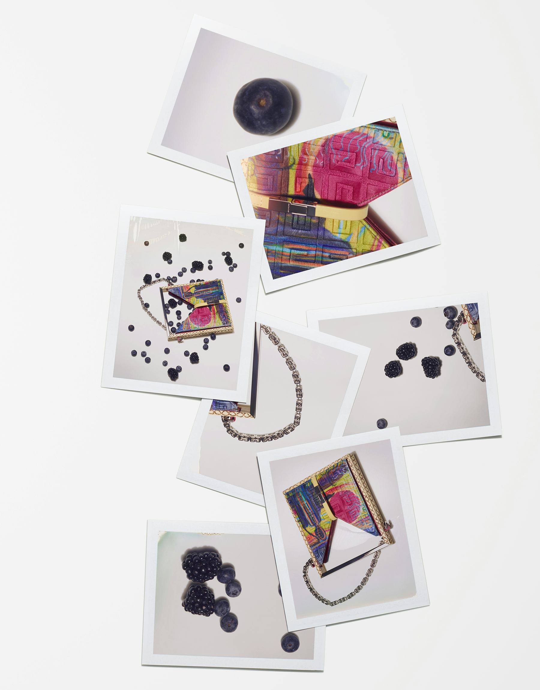 A painted Givenchy bag with blackberries.