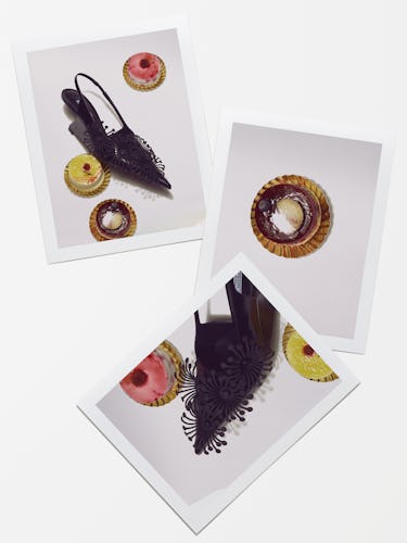 Black Prada heels with apples.