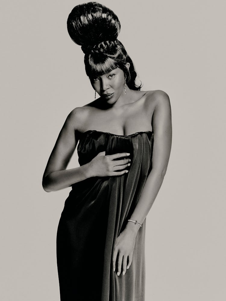 Naomi Campbell wears Saint Laurent by Anthony Vaccarello dress; Tiffany & Co. earrings and bracelet.