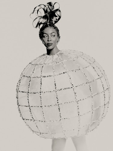 Naomi Campbell wears disco ball dress by Halpern.