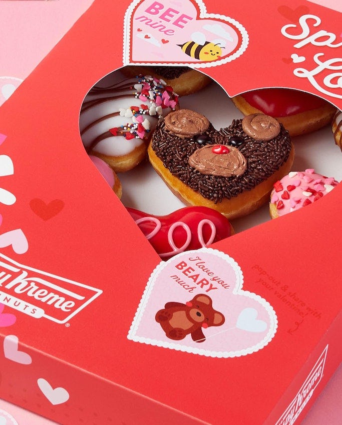 Krispy Kreme's Valentine's Day 2022 doughnut collection features four doughnuts with bear and bee de...