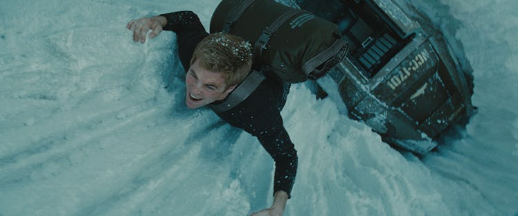 Chris Pine climbing the snow ledge as Kirk in the Star Trek movie