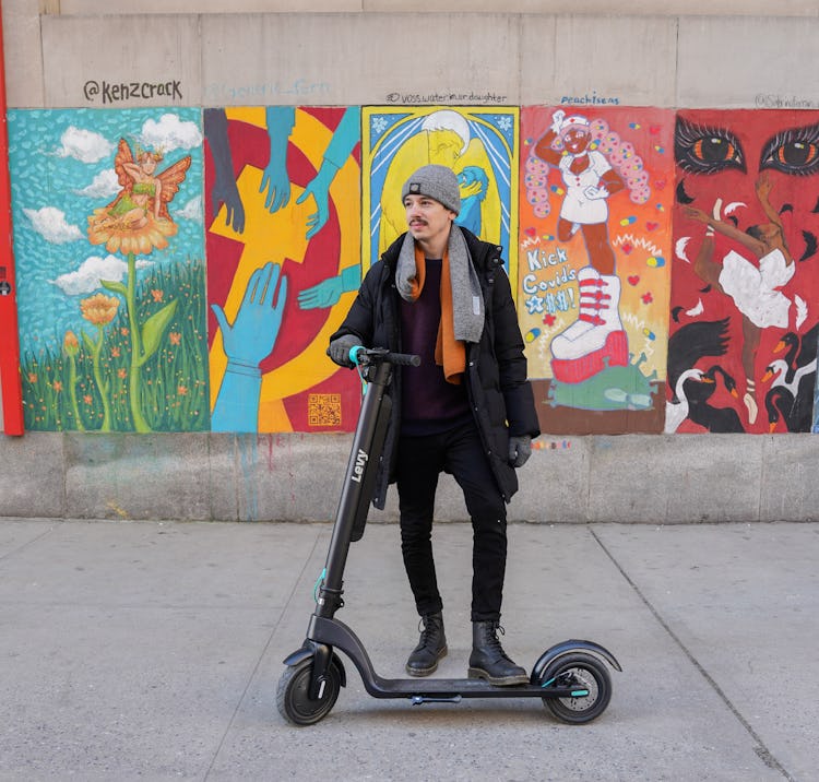 Man on Levy Electric scooter.