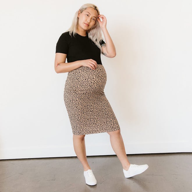 Pregnant woman modeling leopard print pencil skirt