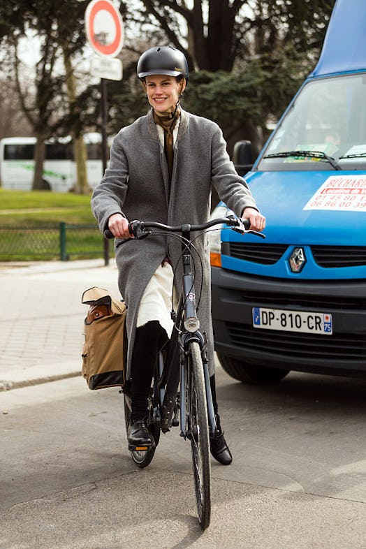 Model biking with a pannier attached to bike.