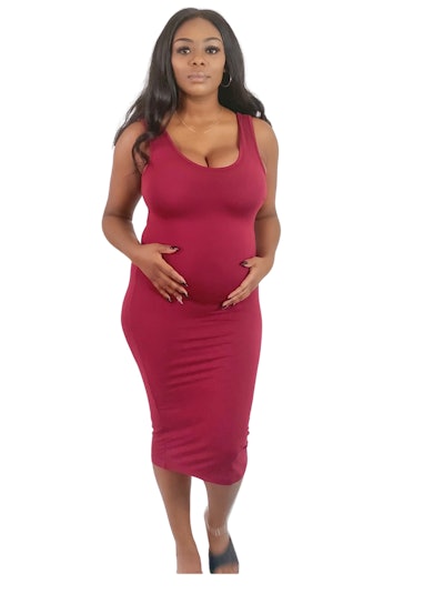 Pregnant woman modeling red sleeveless dress