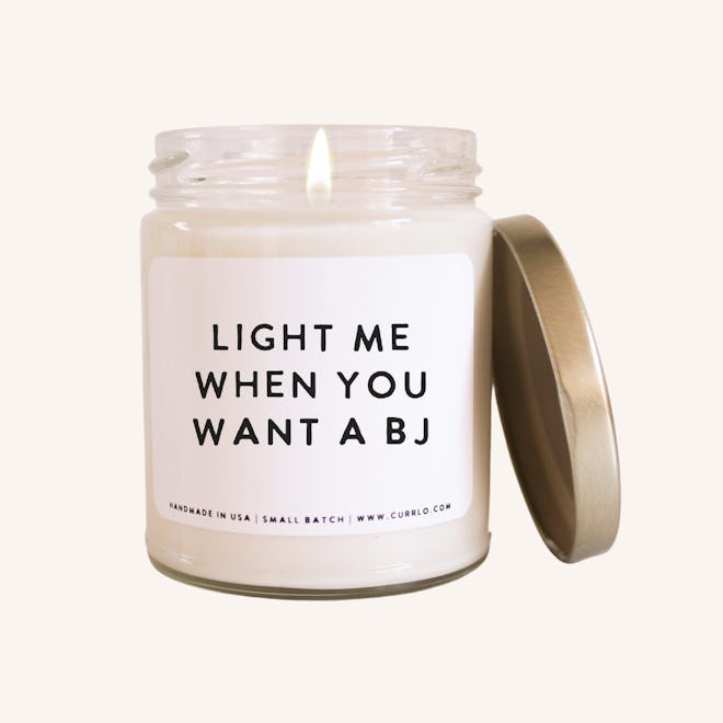 Jarred candle with label that says "light me when you want a BJ"
